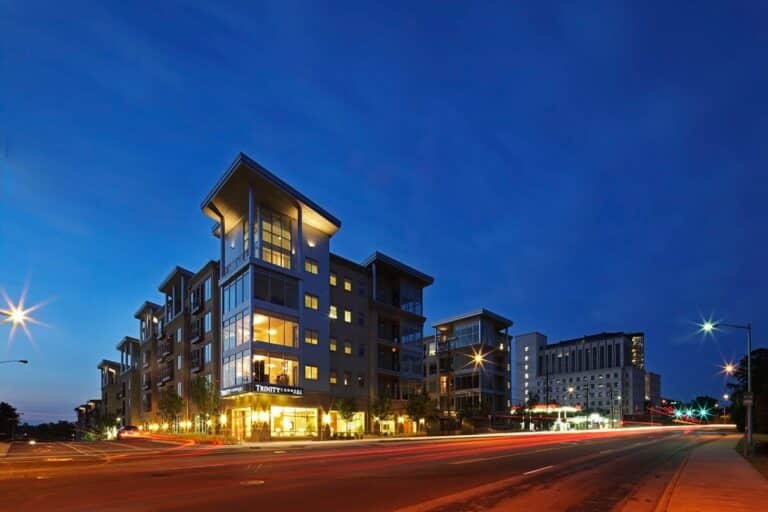 Exterior building shot of Trinity Commons Apartments in Durham at night.